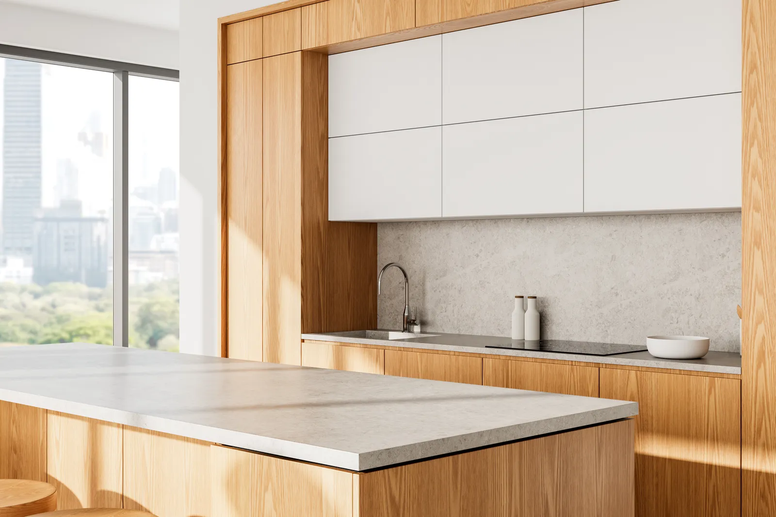 Pale concrete-look island and worktop in an oak kitchen